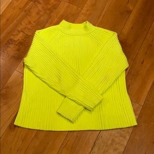 Bright yellow mock neck sweater